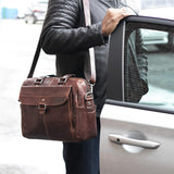 Brown Jack Georges Voyager Zippered Briefcase with front flap pocket, showing sturdy leather construction and organized interior.
