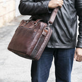 Jack Georges Voyager large travel briefcase with leather exterior, multiple compartments, and sturdy handles for professional travel.
