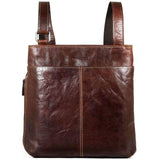 Brown Jack Georges Voyager small zippered crossbody bag with adjustable strap and front pocket for everyday essentials.