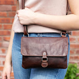 Brown Jack Georges Voyager Wallet on a String crossbody bag with adjustable strap and multiple compartments.