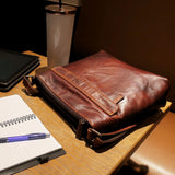 Brown Jack Georges Voyager Zippered Crossbody Hobo Bag with adjustable strap and spacious interior, made of durable leather.