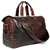 Jack Georges Voyager day bag duffle in brown leather with handles and zipper closure, showing a spacious travel bag design.