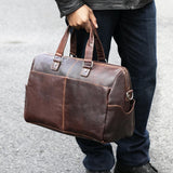 Jack Georges Voyager Day Bag duffle with leather handles and spacious interior, shown in a lifestyle setting.