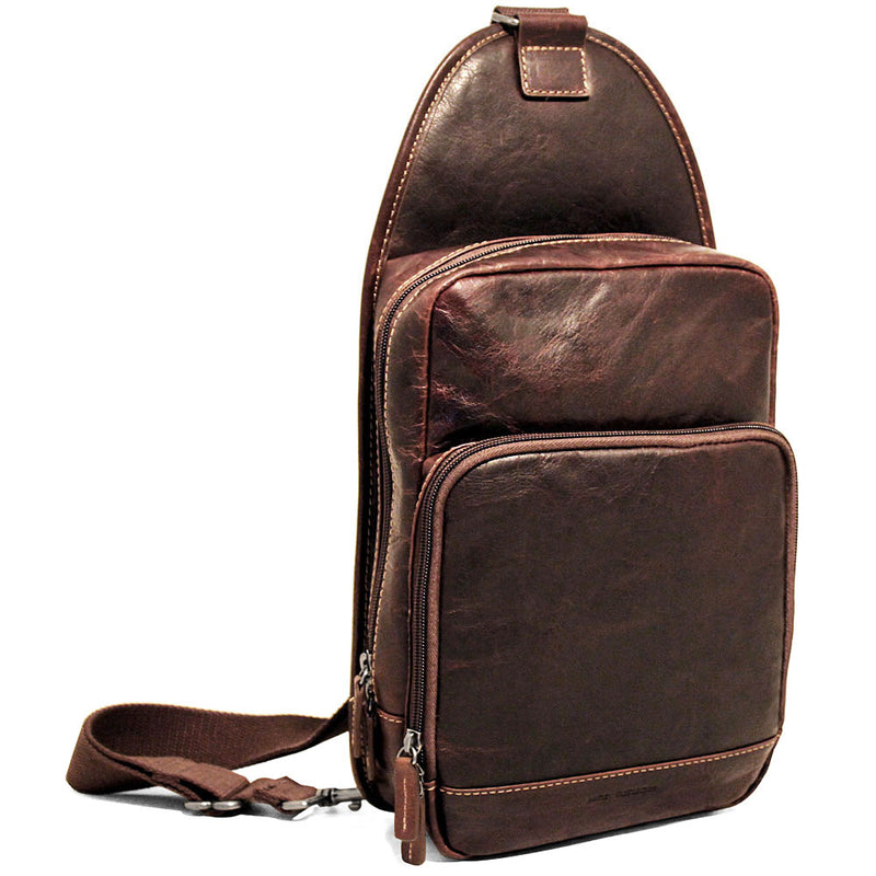 Jack Georges Voyager Sling Bag in brown leather with adjustable strap and multiple compartments.