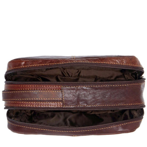 Brown Jack Georges Voyager Toiletry Bag with durable leather exterior and compact design for travel organization.
