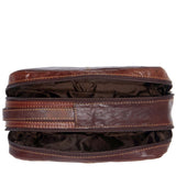 Brown Jack Georges Voyager Toiletry Bag with durable leather exterior and compact design for travel organization.
