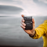 Black Matador Pocket Blanket 2.0, compact outdoor accessory for picnics and travel, with durable fabric and easy fold design.