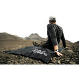 Black Matador Pocket Blanket 2.0 accessory, compact outdoor blanket for picnics and travel, featuring durable fabric and easy packability.