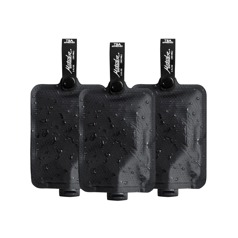 Matador FlatPak™ Toiletry Bottle 3-Pack in charcoal, compact travel accessories with secure caps, ideal for toiletries.