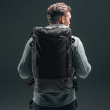 Matador GlobeRider45 travel backpack in white with multiple compartments and padded straps, designed for efficient travel organization.