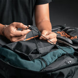 White Matador GlobeRider45 travel backpack with multiple compartments and ergonomic straps, designed for durable outdoor adventures.