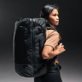 White Matador GlobeRider45 travel backpack with multiple compartments and padded straps, designed for versatile travel and outdoor adventures.