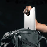 Matador GlobeRider45 travel backpack in white with multiple compartments and padded shoulder straps for comfortable travel.