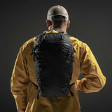 Matador Freefly16 packable backpack shown in a natural outdoor setting, highlighting its compact design and lightweight construction.