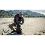 Matador Freefly16 packable backpack shown folded and partially unfolded, lightweight and compact travel and outdoor backpack.