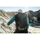 Matador Freerain22 waterproof packable backpack in black, showing its compact design and adjustable shoulder straps.