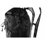Matador Freerain22 waterproof packable backpack in black, showing its compact design and adjustable straps.