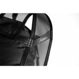 Matador Freerain22 waterproof packable backpack in black, with adjustable shoulder straps and compact folded design.