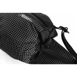 Matador Freerain waterproof packable hip pack shown in black, compact and lightweight waist pack with adjustable strap.