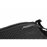 Matador Freerain waterproof packable hip pack in black with adjustable waist strap and compact design for outdoor activities.