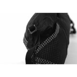Matador Freerain waterproof packable waist pack, black, compact design with adjustable strap for outdoor activities and organization.