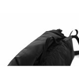 Matador Freerain waterproof packable hip pack in black, showing adjustable waist strap and compact design for outdoor activities.