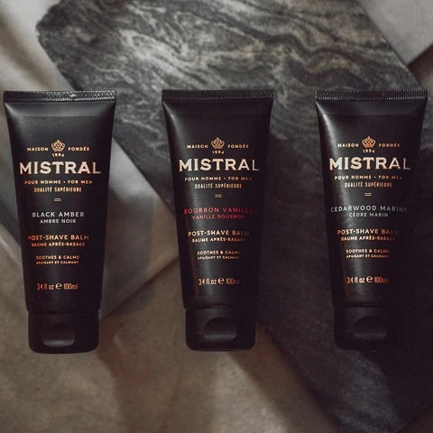 Mistral men's post shave balm in black amber, featuring a sleek container with a smooth balm texture for soothing after-shave care.