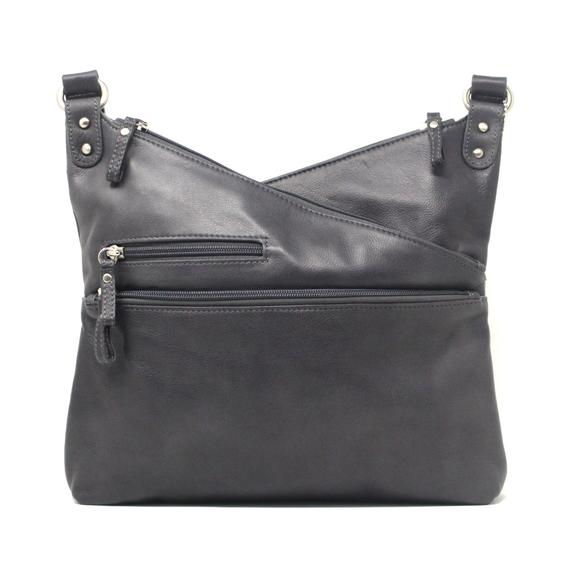 Black Osgoode Marley Kriss Kross Traveler handbag with adjustable straps and multiple compartments, stylish and functional for travel.