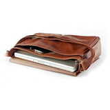 Black Osgoode Marley messenger bag with adjustable strap and front pocket, made of durable leather for everyday use.