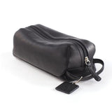 Small leather Osgoode Marley travel kit toiletry bag with zipper closure and compact design, perfect for organizing travel essentials.