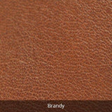Small leather travel kit by Osgoode Marley, stylish toiletry bag in rich brandy leather with compact design and zipper closure.