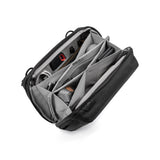 Peak Design Tech Pouch with multiple compartments and black fabric, designed for organizing tech accessories and cables.