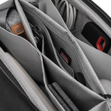 Peak Design Tech Pouch in black, showing organized compartments and sleek fabric ideal for storing tech accessories.