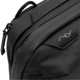 Peak Design Tech Pouch shown in lightbox, compact black organizer with multiple compartments for tech accessories and cables.