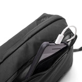 Peak Design Tech Pouch with multiple compartments and zipper closures, designed for organizing electronic accessories and gadgets.
