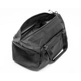 Black Peak Design Travel Duffel 35L with sturdy handles and adjustable shoulder strap, designed for versatile travel and storage.