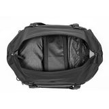 Black Peak Design Travel Duffel 35L bag with sturdy handles and adjustable shoulder strap, shown from side view.