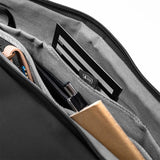 Black Peak Design Travel Duffel 35L bag with sturdy handles and zipper closure, designed for versatile travel and storage.