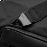Black Peak Design Travel Duffel 35L with sturdy handles and adjustable shoulder strap, showing spacious main compartment.