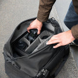 Black Peak Design Travel Duffel 35L bag with sturdy handles and a spacious main compartment, ideal for travel and outdoor use.
