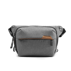 Peak Design Everyday Sling in ash color, compact shoulder bag with adjustable strap, designed for quick access and organization.
