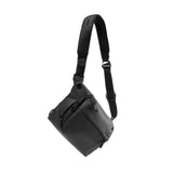 Black Peak Design Everyday Sling with adjustable strap, showing multiple compartments and sleek compact design for daily use.