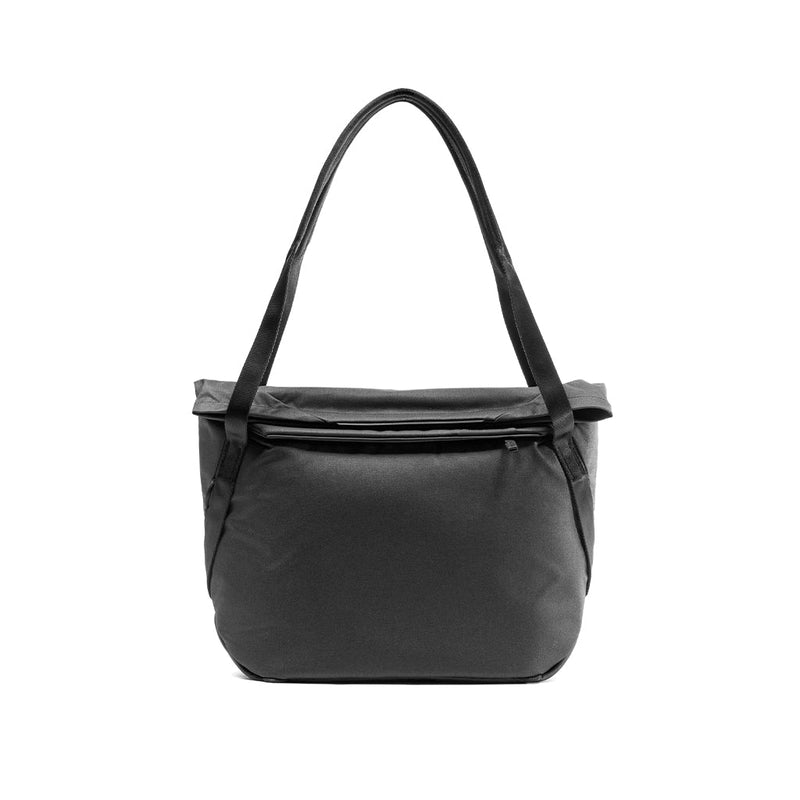 Peak Design Everyday Tote bag with adjustable straps, spacious main compartment, and sleek black fabric for versatile everyday use.