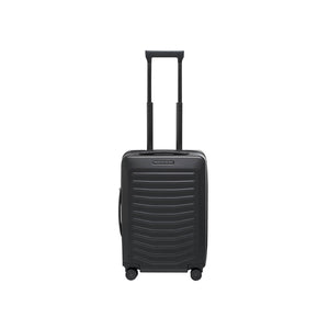 Matte black Porsche Design Roadster 21-inch spinner carry-on luggage with four wheels and sleek modern design.