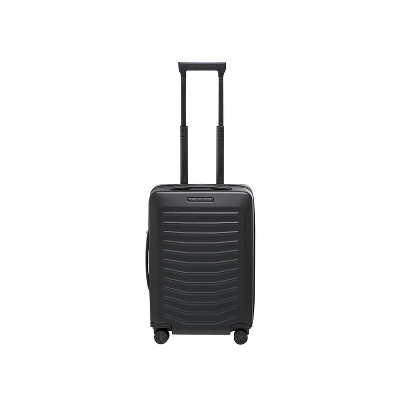 Matte black Porsche Design Roadster 21-inch spinner carry-on luggage with four wheels and sleek modern design.