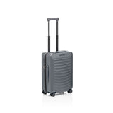 Matte black Porsche Design Roadster 21-inch spinner carry-on luggage with four wheels and sleek modern design.