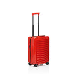 Matte black Porsche Design Roadster 21-inch spinner carry-on luggage with four wheels and sleek modern design.
