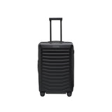 Matte black Porsche Design Roadster 27-inch expandable spinner luggage with four wheels and sleek modern design.