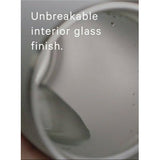 Purist Mover 18oz water bottle in clear with black lid, durable design, and sleek branding for hydration on the go.