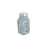 Que Bottle accessory in clear, durable plastic with a sleek design, featuring the Que brand logo on the side.